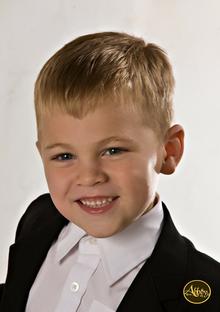 Alex Barton, a 5-year-old boy with blond hair and a big smile